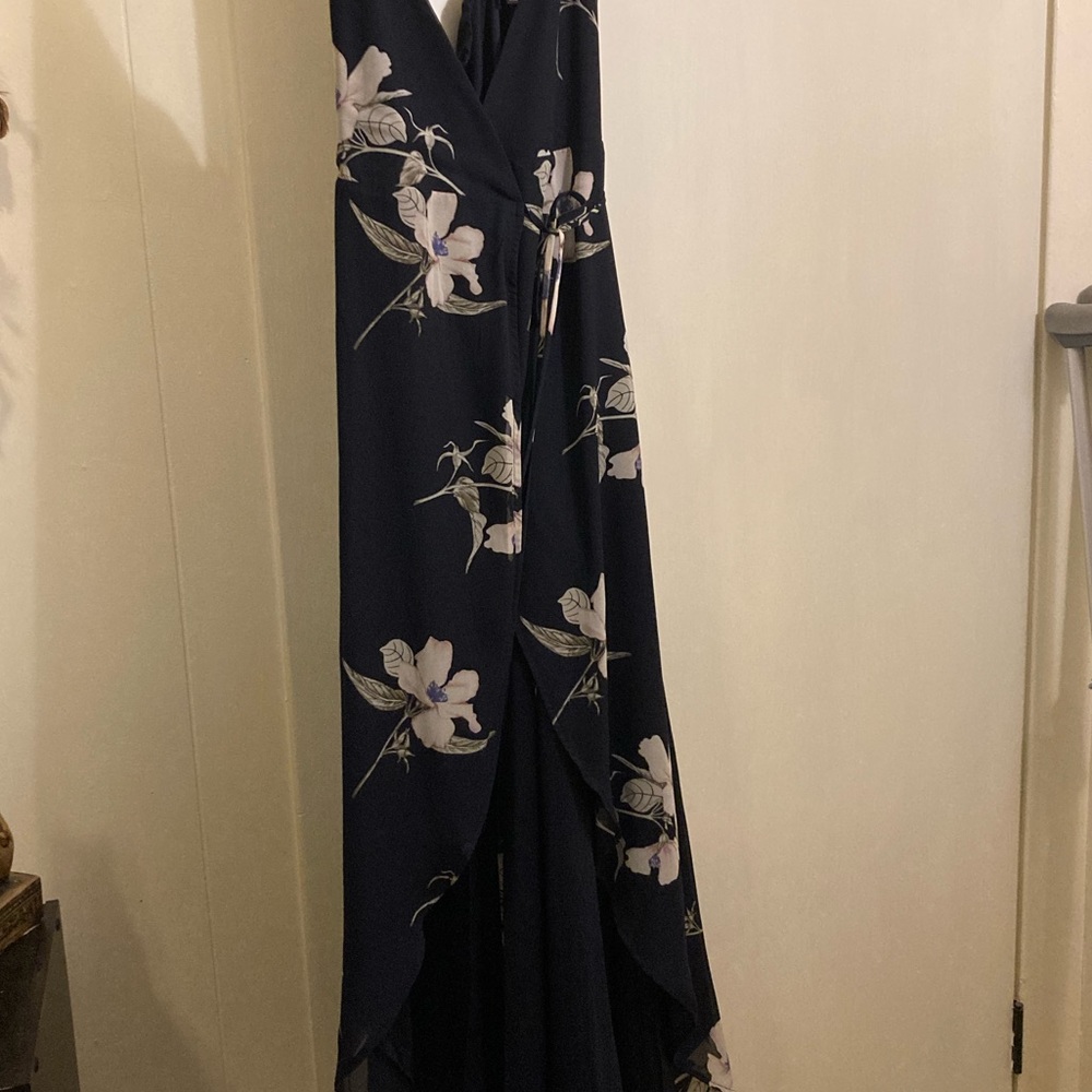 Lulus navy wrap around high low dress. Has adjustable straps. No rips or tears.